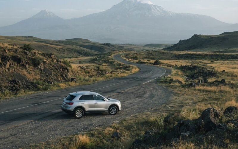 Rental car parked on an empty mountain road in the Armenian highlands