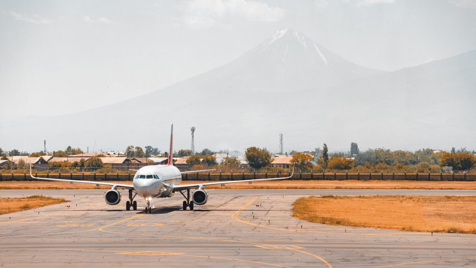 A plane on the Zvartnots airport taxiway with Mount Ararat behind it
